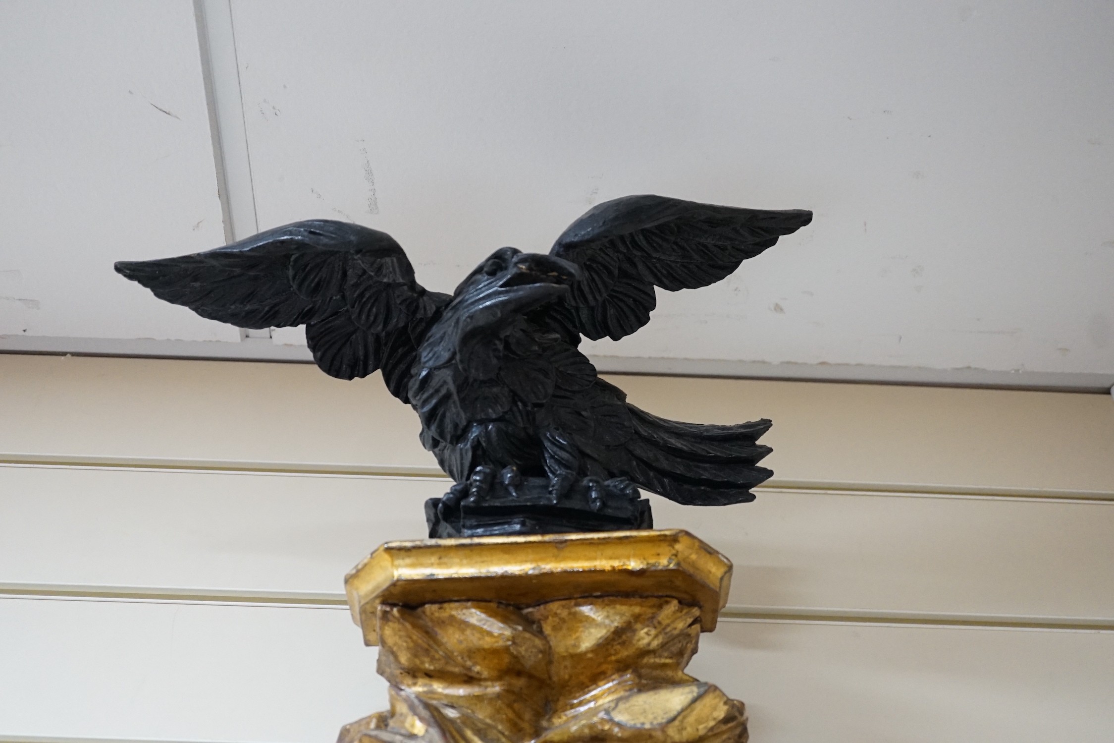 A Regency ebonised and giltwood convex wall mirror, height 87cm *Please note the sale commences at 9am.